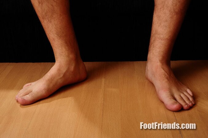 Nick shows his big feet while wearing sexy socks