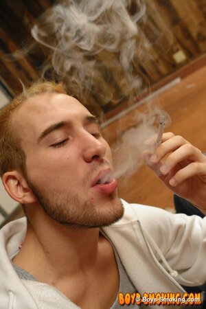 Marcus Mojo smokes while Jacob Wright gives him a hot blowjob in the garage