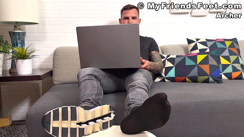 Archer Croft teases with his socked feet before stripping down