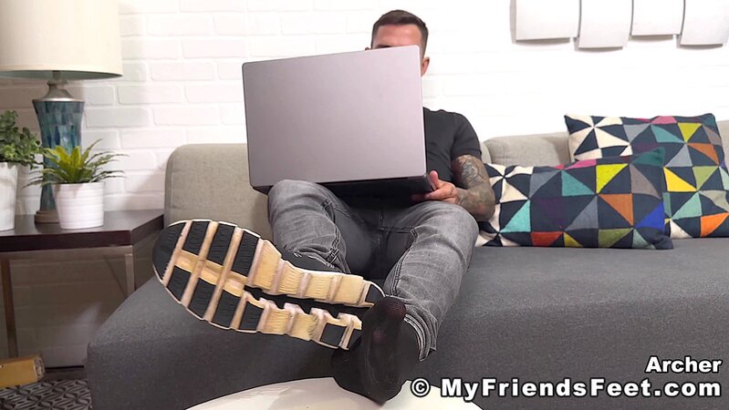 Archer Croft teases with his socked feet before stripping down