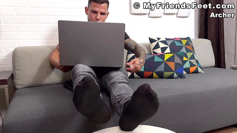 Archer Croft teases with his socked feet before stripping down