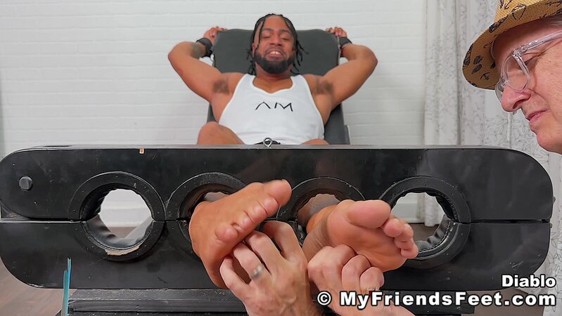 Diablo laughs uncontrollably as his ticklishness is put to the test