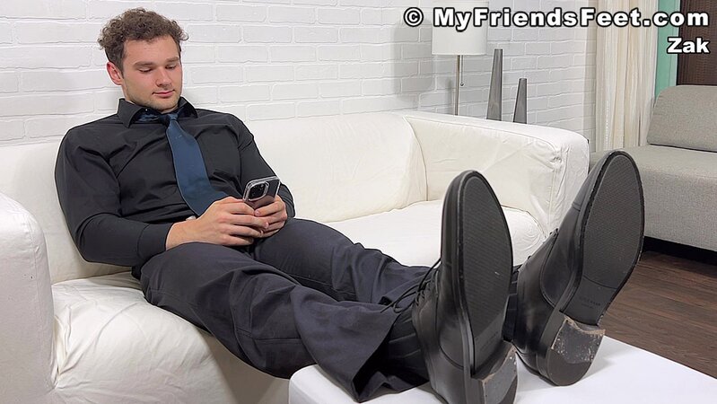 Zak takes off his socks to expose his stunning muscle physique