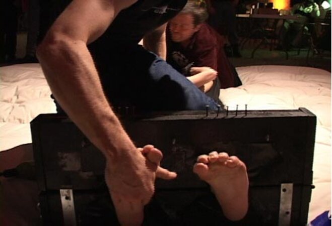 Volunteers submit to playful tickling at the World Tickling Federation's first event