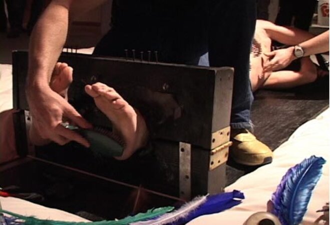 Volunteers submit to playful tickling at the World Tickling Federation's first event