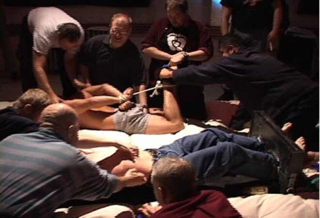 Volunteers submit to playful tickling at the World Tickling Federation's first event