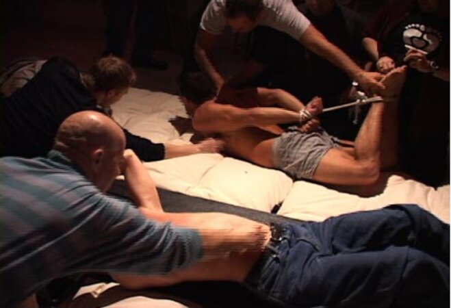 Volunteers submit to playful tickling at the World Tickling Federation's first event
