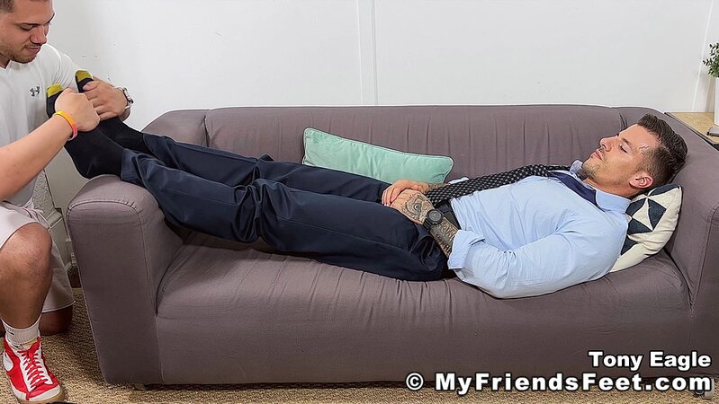 Tony Eagle relaxes as Dan Edwards worships his bare feet