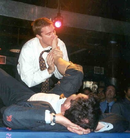 Men in suits gather for a thrilling foot fetish party