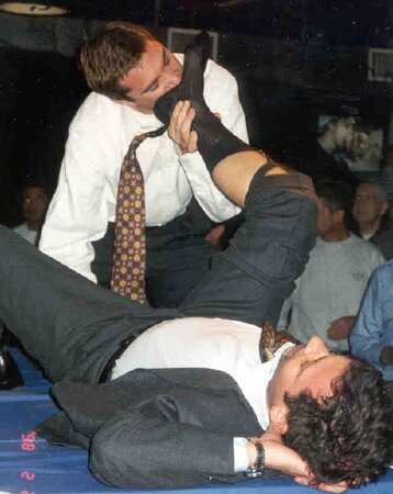 Men in suits gather for a thrilling foot fetish party