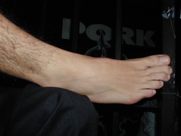 Men in suits gather for a thrilling foot fetish party
