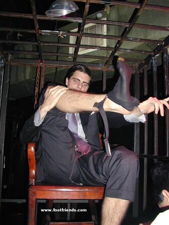 Men in suits gather for a thrilling foot fetish party