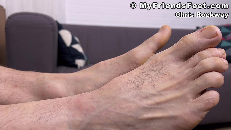 Chris Rockway shows off his athletic socks before going barefoot
