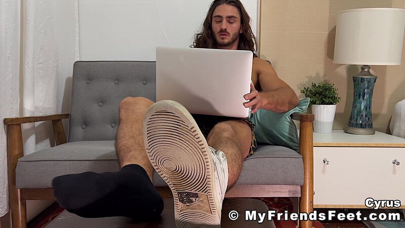 Cyrus slowly removes his socks to reveal his beautiful bare feet