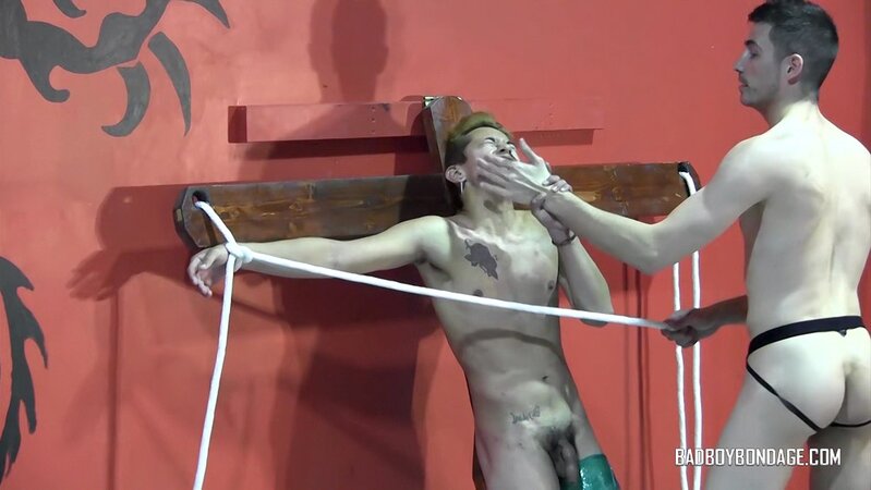 Tye flogs Whiskey against the cross