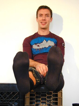 Scott strips socks to reveal his size 10 feet