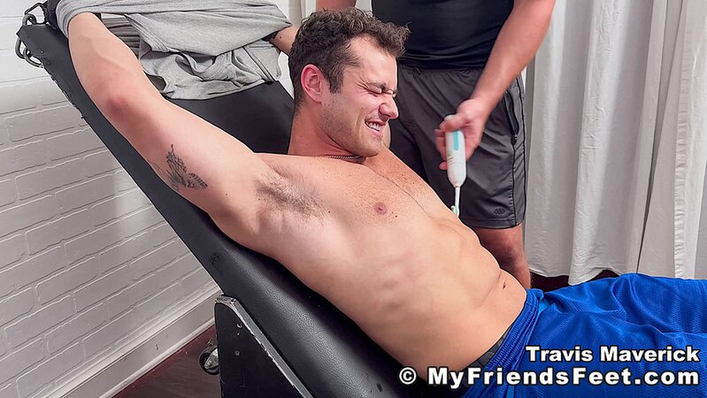 Dan Edwards tickles Travis Maverick’s feet and he laughs