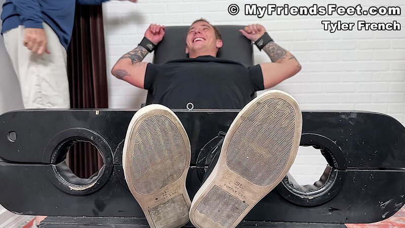 Tyler French giggles as Dan Edwards tickles his sides