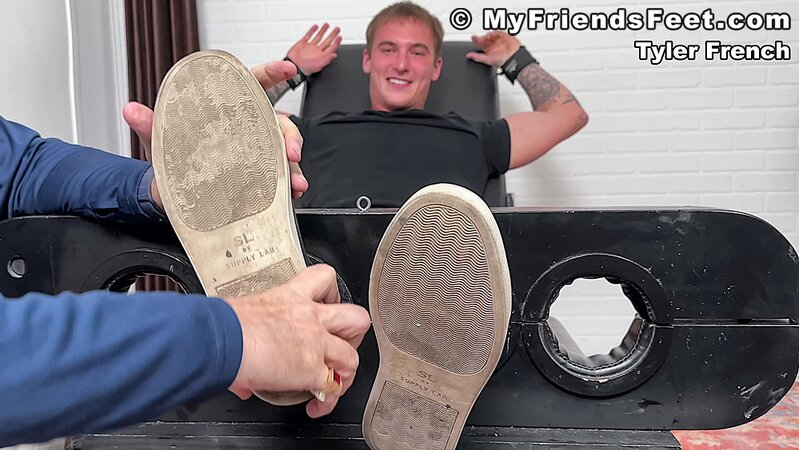 Tyler French giggles as Dan Edwards tickles his sides