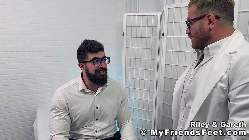 Dr. Riley strokes cock as Gareth licks his soles