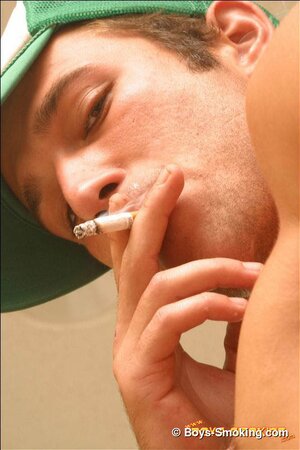 Cowboy Cody masturbates hard while smoking and shows his bubble butt