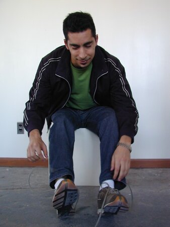 Sebastian shows his sweaty white socks after gym