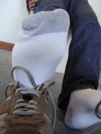 Sebastian shows his sweaty white socks after gym
