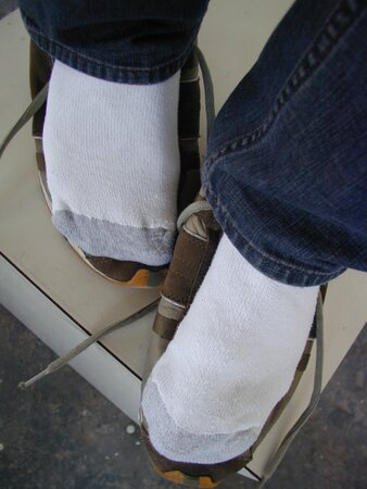 Sebastian shows his sweaty white socks after gym