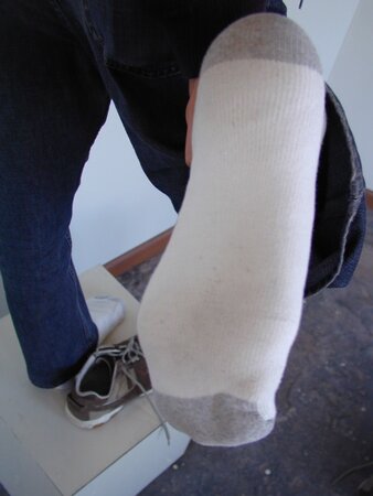 Sebastian shows his sweaty white socks after gym