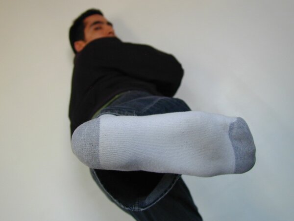 Sebastian shows his sweaty white socks after gym