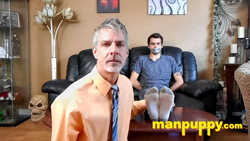 Kody Tracer squirms as Richard Lennox tickles with brush
