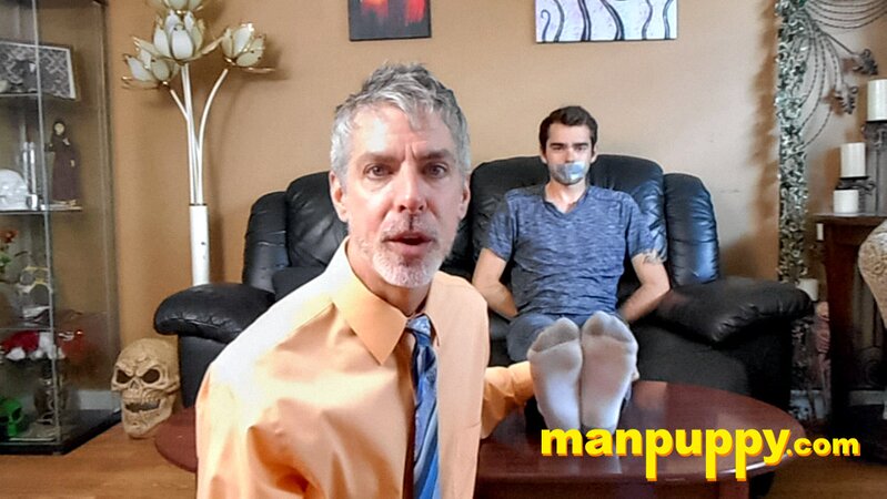 Kody Tracer squirms as Richard Lennox tickles with brush