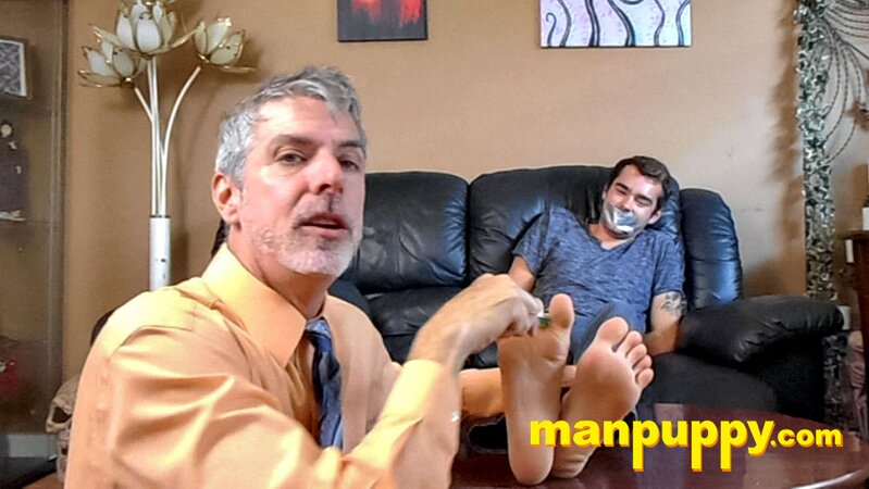 Kody Tracer squirms as Richard Lennox tickles with brush