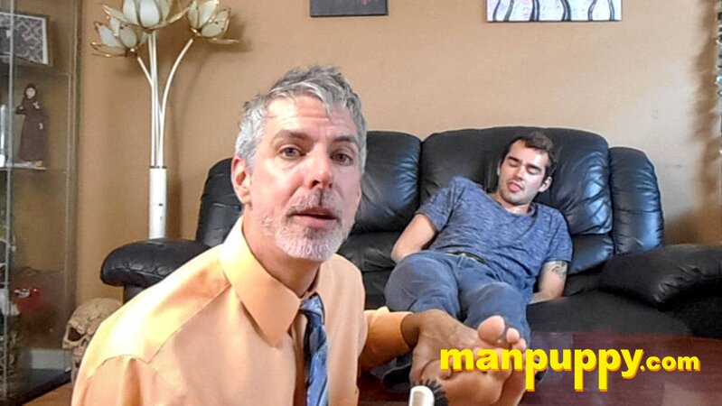 Kody Tracer squirms as Richard Lennox tickles with brush