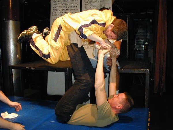 Tommi balances Alan Pratt with his size 14 feet