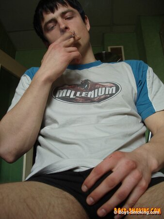 Gus Kitchen strokes his cock while smoking and cums fast